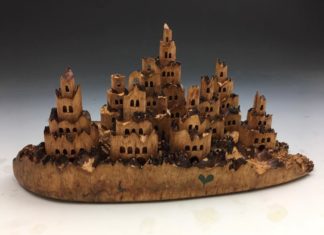 Man Carves Amazing Pop-Up Castles out of Tree Trunks